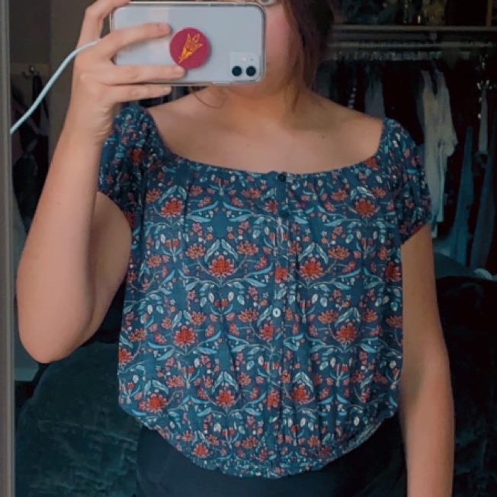 blue off the shoulder button-up shirt